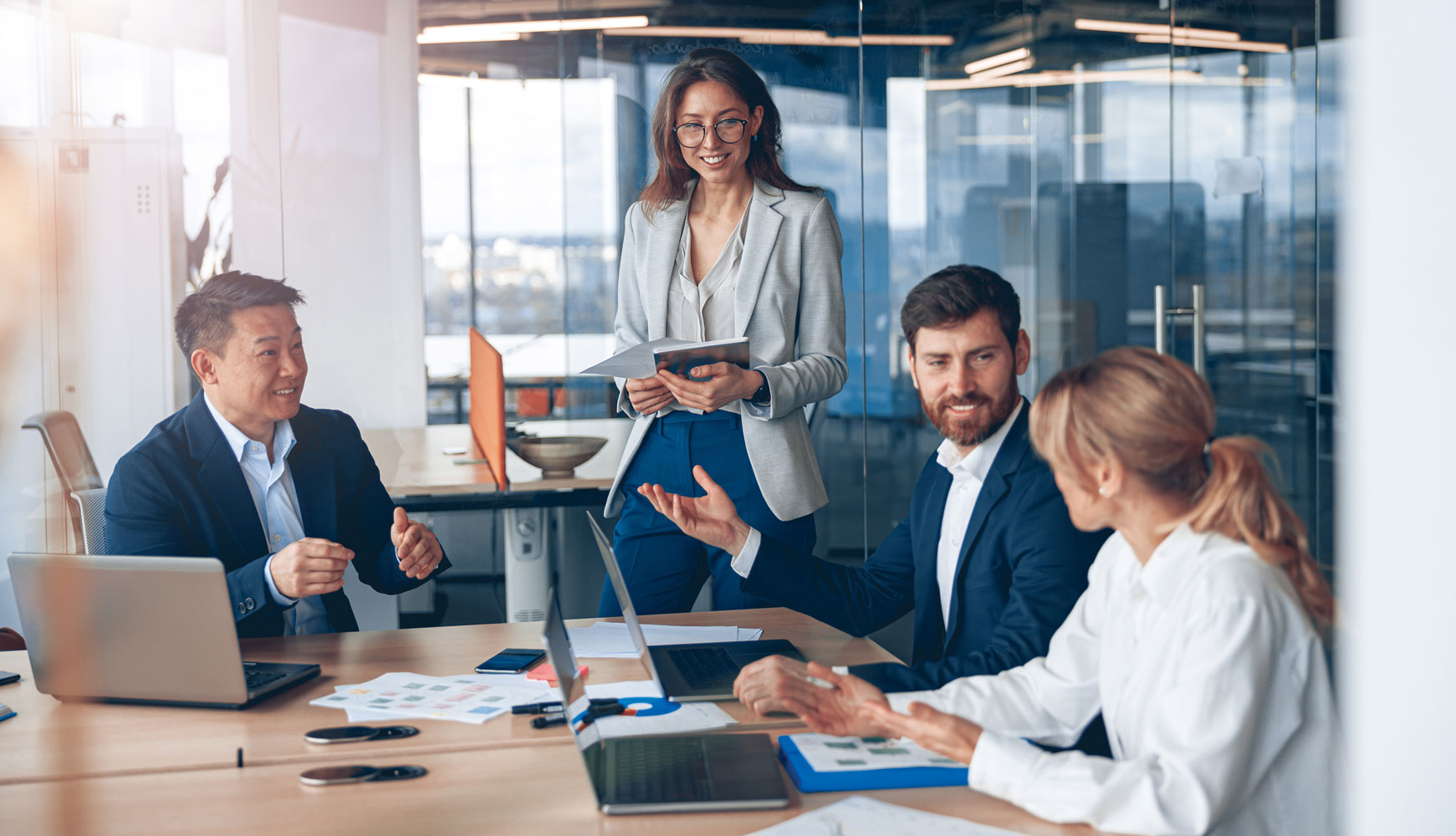 Business meeting in modern conference room, professionals collaborating and discussing strategies, highlighting process & share growth